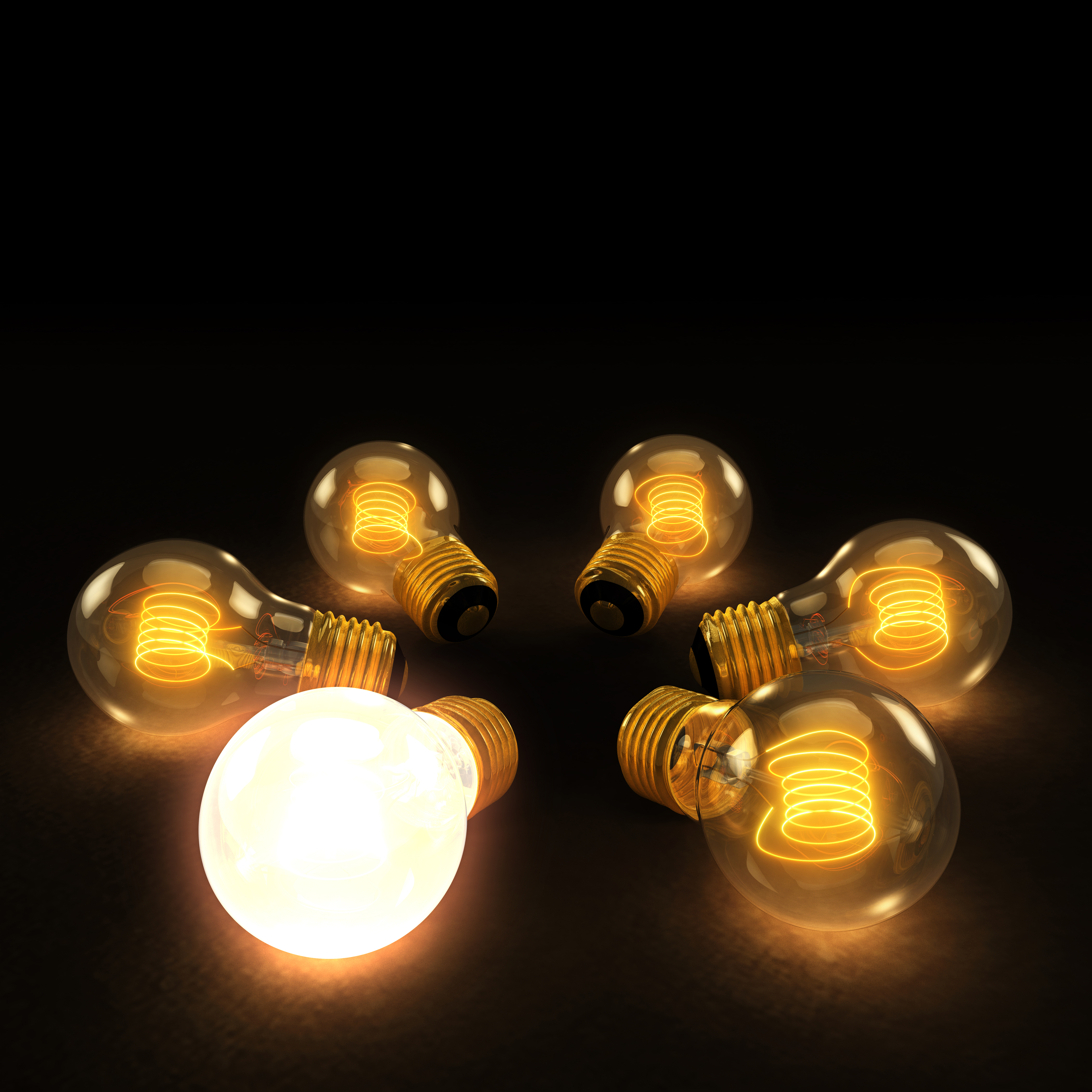 One lit lightbulb surrounded by dim ones or an image of one gold egg surrounded by white ones.